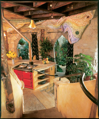 The hub of the Starek hom, the kitchen is surrounded by a free-form sculpture. The cast-iron Aga stove has two ovens, perfect for slow-roasting meats and vegetables. "I like a simple, old-fashioned kitchen," Alice says. "I don't use gadgets; there's no microwave or toaster."